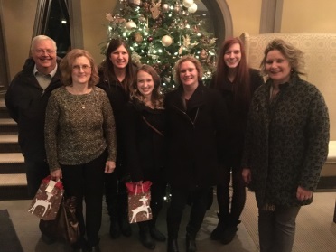 posing in front of Christmas Tree